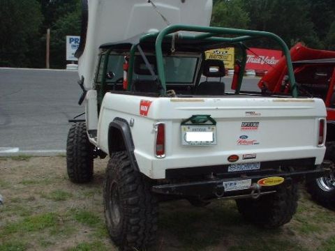 1978 Ford Bronco - This 1978 Ford Bronco features a green roll cage and aggressive off-road tires, ready for any adventure.