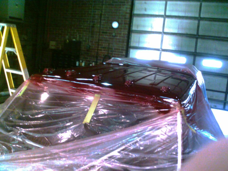 Red roof with lights covered in plastic wrap