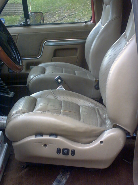 1989 Ford Bronco - Interior view of tan leather bucket seats, power controls, in a 1989 Ford Bronco.
