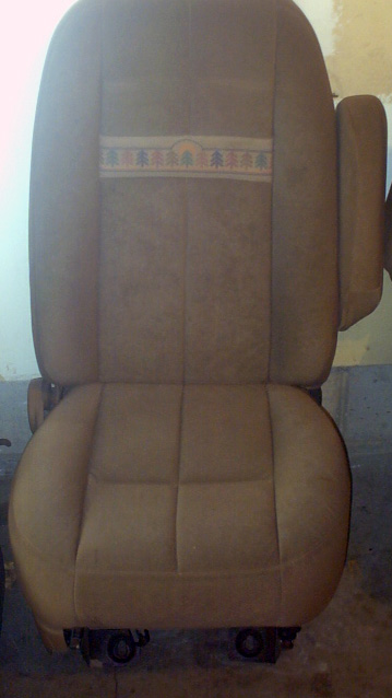 1989 Ford Bronco - A single car seat with a patterned stripe is shown, likely removed from a vehicle.