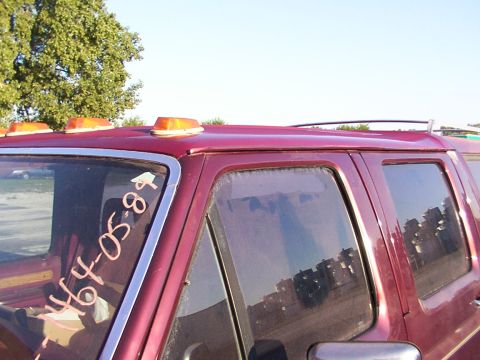 1988 Ford C-350 (Centurion Conversions) - Handwritten '1988' is visible on the driver's side window of the red van.
