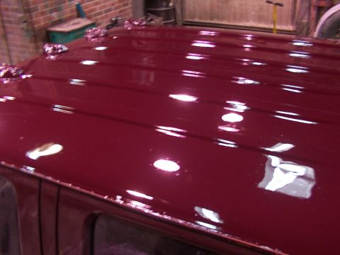 1988 Ford C-350 (Centurion Conversions) - Shiny red roof with multiple raised mounts visible.