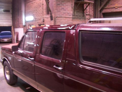 1988 Ford C-350 (Centurion Conversions) - This extended cab pickup truck has a custom roof extension, altering its original body style.