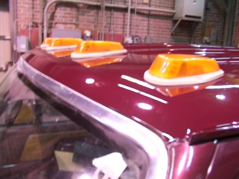 1988 Ford C-350 (Centurion Conversions) - Close-up view of amber cab roof lights on a vehicle.