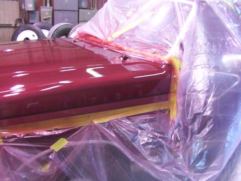 1988 Ford C-350 (Centurion Conversions) - A vehicle is being prepped for painting, with protective coverings in place.