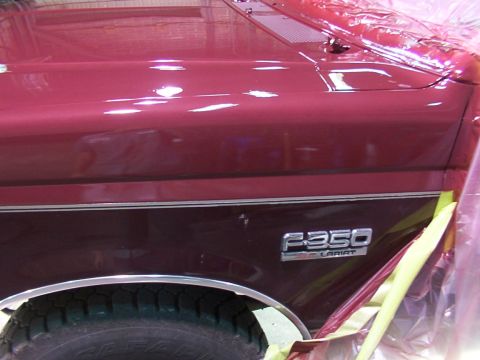 1988 Ford C-350 (Centurion Conversions) - Fender emblem reads F-350 Lariat, with the vehicle body covered in protective plastic.