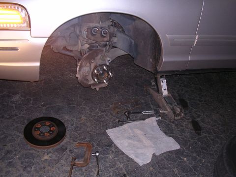 2003 Ford Crown Victoria - Front Axle Change The caliper and rotor removed.