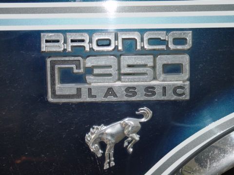 1979 Ford Bronco - Close-up of a Bronco C350 Classic emblem with a horse emblem below it.