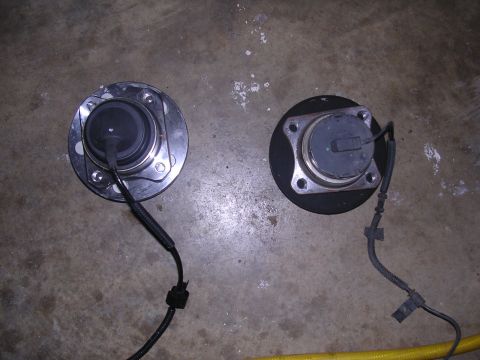 2003 Ford Crown Victoria - New axel on left, old axel on right.