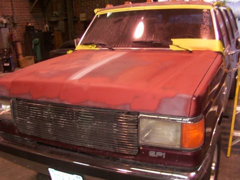1988 Ford C-350 (Centurion Conversions) - The front of a Ford F-Series truck, showing the grille and hood area being prepared for paintwork.