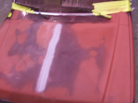 1988 Ford C-350 (Centurion Conversions) - Hood of a 1988 Ford C-350 (Centurion Conversions) undergoing bodywork, showing primer and masking tape.
