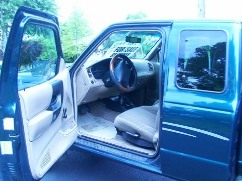 1998 Ford Ranger - Only shot I have inside, In case the color doesn't come through, its green outside and tan inside. Extended cab with two mini seats in the…