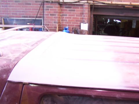 1988 Ford C-350 (Centurion Conversions) - The roof of a vehicle is visible, with a section appearing to be prepped for paintwork.