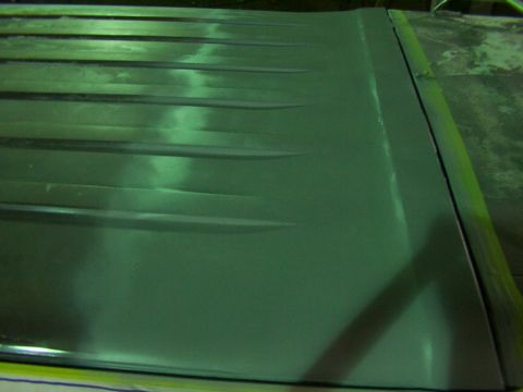 1988 Ford C-350 (Centurion Conversions) - Close-up view of a green roof panel distinct horizontal ridges.