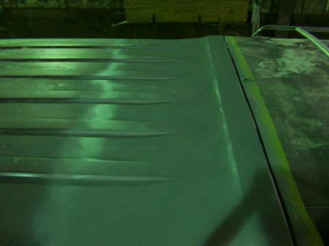 1988 Ford C-350 (Centurion Conversions) - Corrugated metal panel, possibly from a truck bed or industrial application.