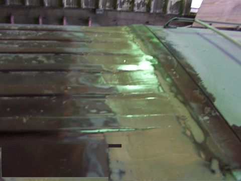 1988 Ford C-350 (Centurion Conversions) - Close-up of a vehicle's roof panel, indicating bodywork in progress.