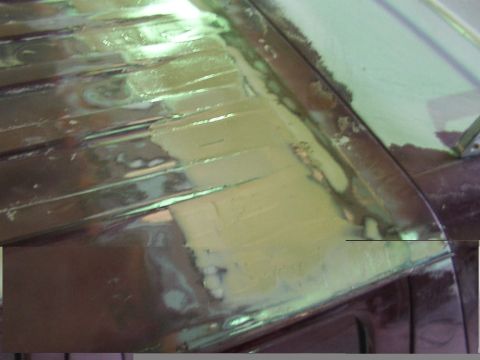 1988 Ford C-350 (Centurion Conversions) - Close-up of roof bodywork showing primer and filler application.