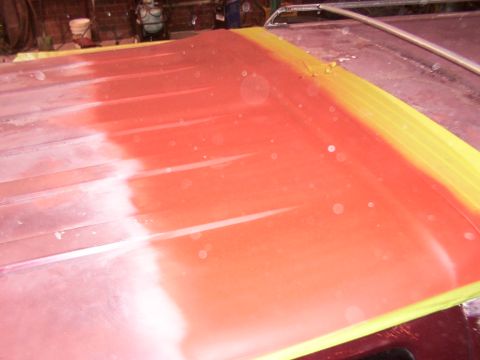 1988 Ford C-350 (Centurion Conversions) - Roof panel covered in red primer and masked with yellow tape, indicating bodywork in progress.