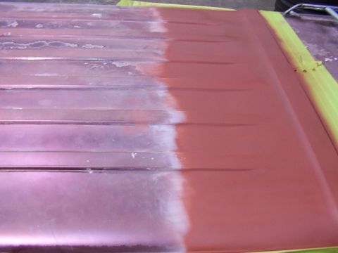 1988 Ford C-350 (Centurion Conversions) - A vehicle roof panel shows primer and sanding marks, indicating preparation for a new paint job.