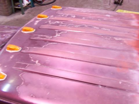1988 Ford C-350 (Centurion Conversions) - Vehicle roof panel with amber marker lights, showing signs of paint peeling and damage.