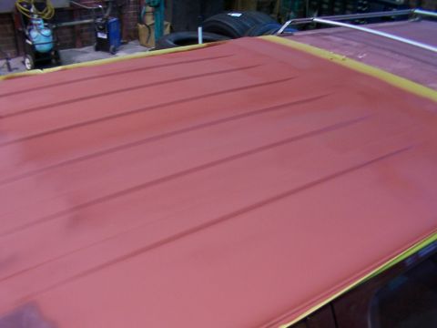 1988 Ford C-350 (Centurion Conversions) - Vehicle roof being prepped for paint, showing primer and masking tape.