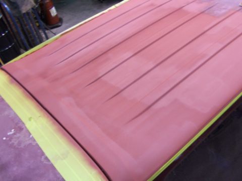1988 Ford C-350 (Centurion Conversions) - Vehicle roof being prepped for paint, showing primer and masking tape.