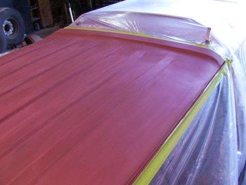 1988 Ford C-350 (Centurion Conversions) - The vehicle's roof is prepped and masked for bodywork, with a large tire visible in the background.