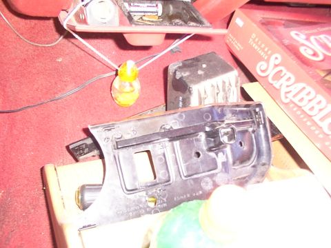 1988 Ford C-350 (Centurion Conversions) - A close-up view of a vehicle's interior dash trim part, showing its mounting points and texture.