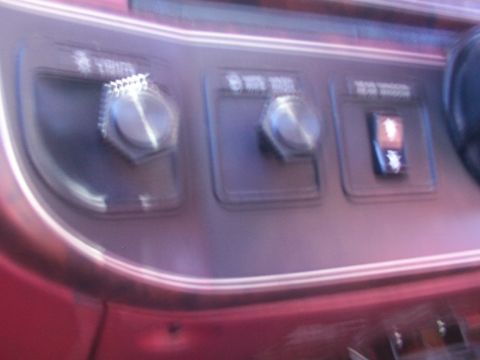 1988 Ford C-350 (Centurion Conversions) - Interior view of dashboard controls, including knobs for lights and wipers, and a switch for the rear window defrost.