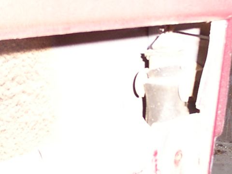 1988 Ford C-350 (Centurion Conversions) - Interior view of a vehicle's door lock mechanism, revealing internal components and wiring.