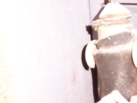 1988 Ford C-350 (Centurion Conversions) - A close-up view of a vehicle's door lock mechanism, showing its internal components.