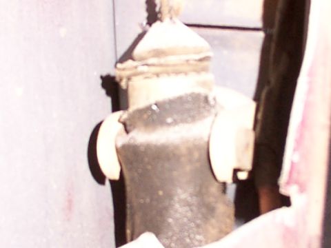 1988 Ford C-350 (Centurion Conversions) - A close-up view of a vehicle's door lock mechanism, showing its internal components.