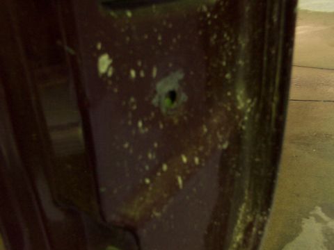 1988 Ford C-350 (Centurion Conversions) - Detail of a door panel, showing a hole where a lock mechanism would be installed.