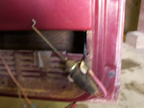 1988 Ford C-350 (Centurion Conversions) - A close-up view of a vehicle's interior door panel, focusing on the door lock actuator mechanism and wiring.