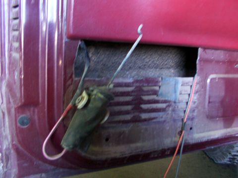 1988 Ford C-350 (Centurion Conversions) - Close-up of a vehicle's internal door lock mechanism and wiring.