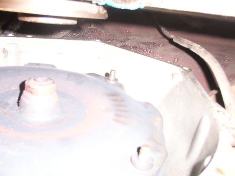1988 Ford C-350 (Centurion Conversions) - This image shows a close-up view of a vehicle's transmission bell housing and surrounding components.
