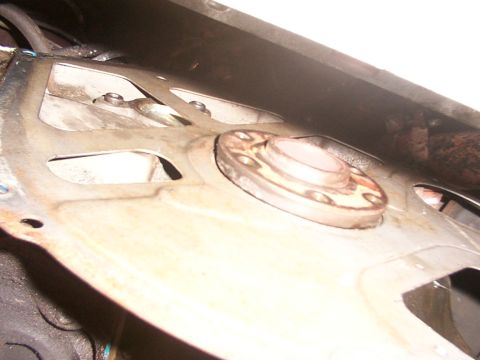 1988 Ford C-350 (Centurion Conversions) - This is a close-up view of a vehicle's transmission bell housing and flywheel assembly.