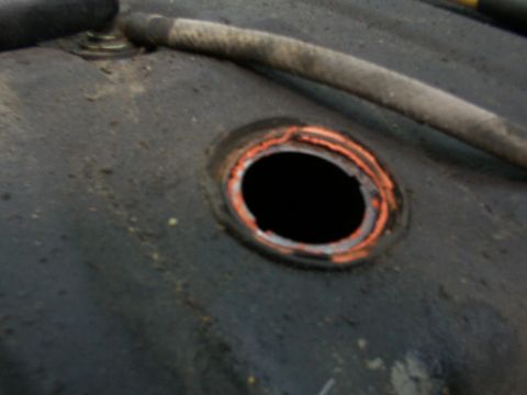 1988 Ford C-350 (Centurion Conversions) - This is a close-up view of the fuel tank opening, showing the orange sealant around the edge.