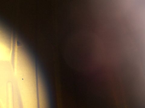 1988 Ford C-350 (Centurion Conversions) - A close-up view of a textured metallic surface, possibly a vehicle part.