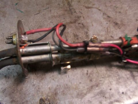 1988 Ford C-350 (Centurion Conversions) - Close-up of a fuel pump sender unit, likely removed from a vehicle for repair or replacement.