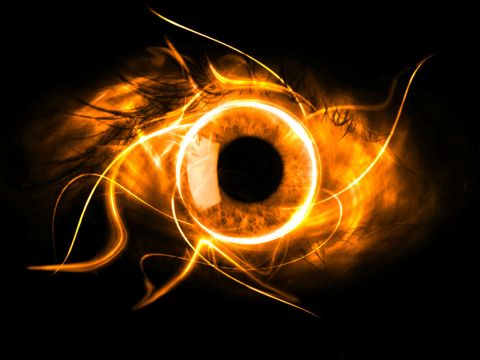 1993 Ford Bronco - An abstract image of a fiery eye with swirling orange and yellow light against a black background.