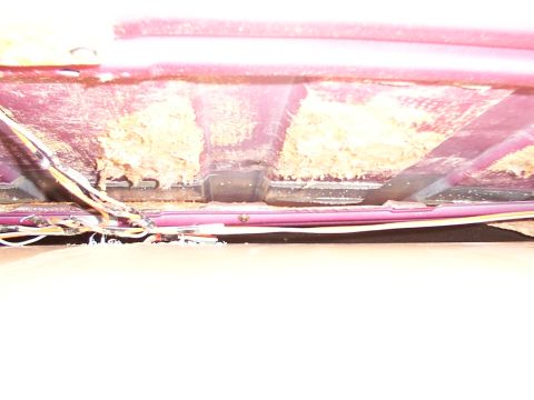 1988 Ford C-350 (Centurion Conversions) - The headliner of a vehicle is shown with damaged insulation and loose wiring visible.