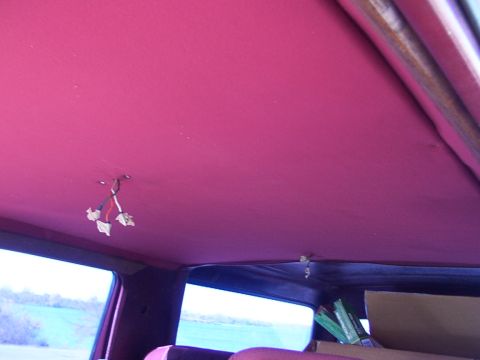 1988 Ford C-350 (Centurion Conversions) - Interior view of a vehicle's headliner with exposed wiring and a view through the windows.