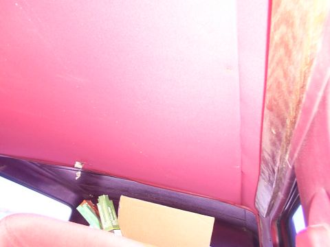 1988 Ford C-350 (Centurion Conversions) - Interior view of a vehicle's headliner, showing the fabric and surrounding trim pieces.