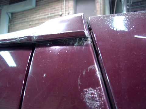 1988 Ford C-350 (Centurion Conversions) - Detail of a body panel seam on a vehicle, showing accumulated dirt and some wear.