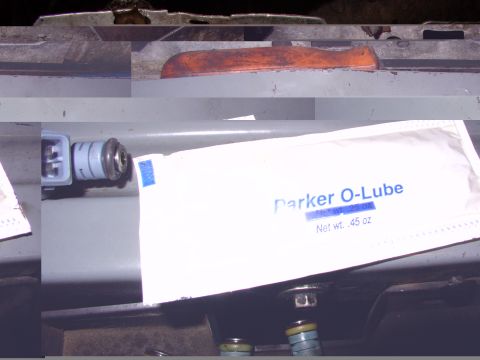 1988 Ford C-350 (Centurion Conversions) - Close-up of a fuel injector and a packet of Parker O-Lube, indicating maintenance or repair work.