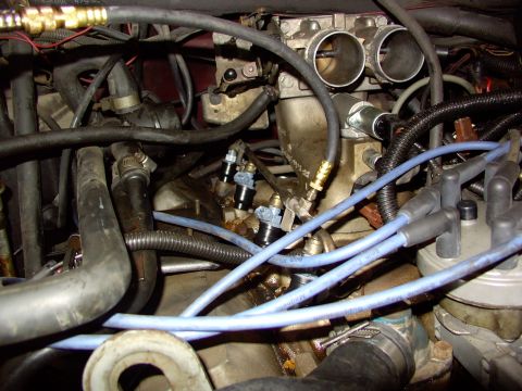 1988 Ford C-350 (Centurion Conversions) - Close-up view of engine components, focusing on the fuel injection system and associated wiring.