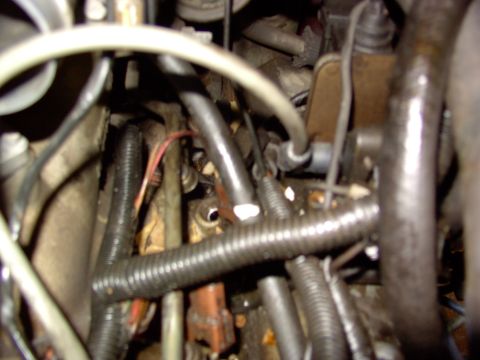 1988 Ford C-350 (Centurion Conversions) - Engine bay wiring and hoses are visible in this close-up view.