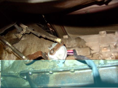 1988 Ford C-350 (Centurion Conversions) - Close-up of transmission components, including the neutral safety switch and linkage.