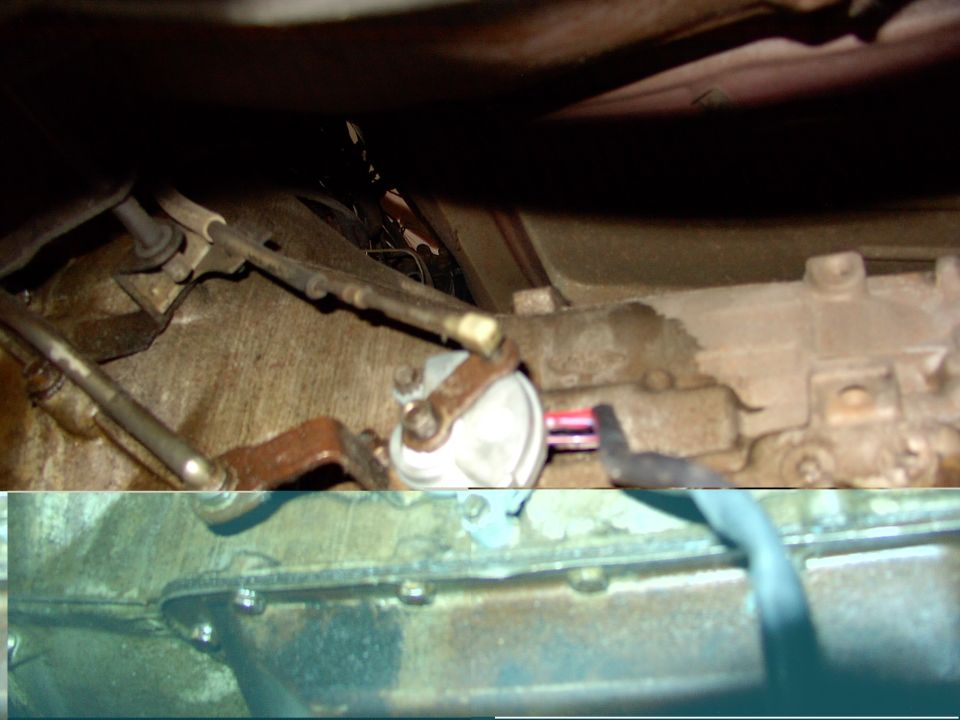 Close-up of rusty engine linkage, sensor connector and oil pan flange bolts under a vehicle